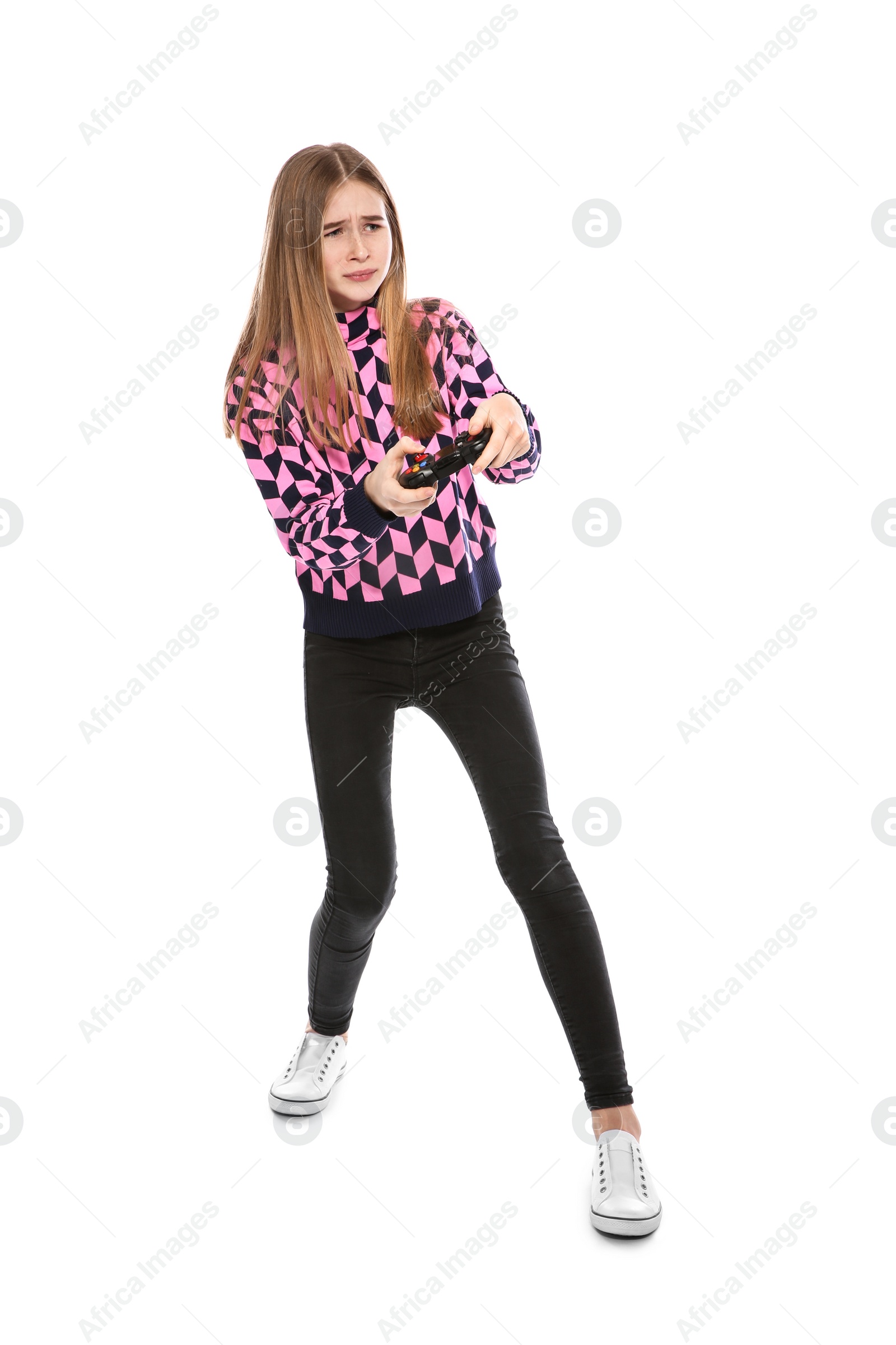 Photo of Teenage girl playing video games with controller isolated on white