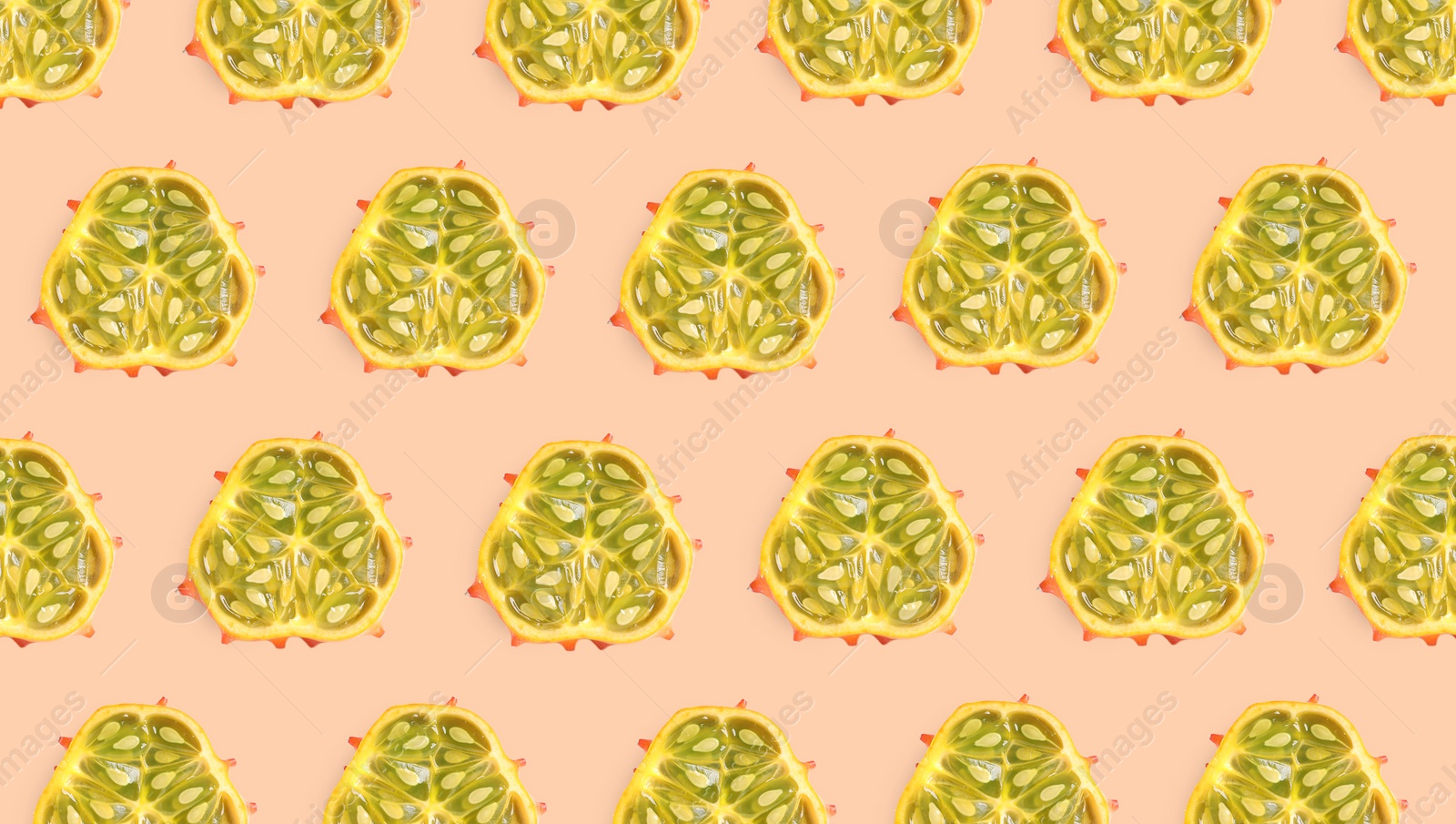 Image of Cut exotic kiwano fruits on beige background, flat lay. Banner design