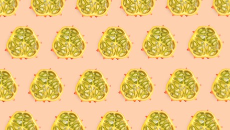 Image of Cut exotic kiwano fruits on beige background, flat lay. Banner design