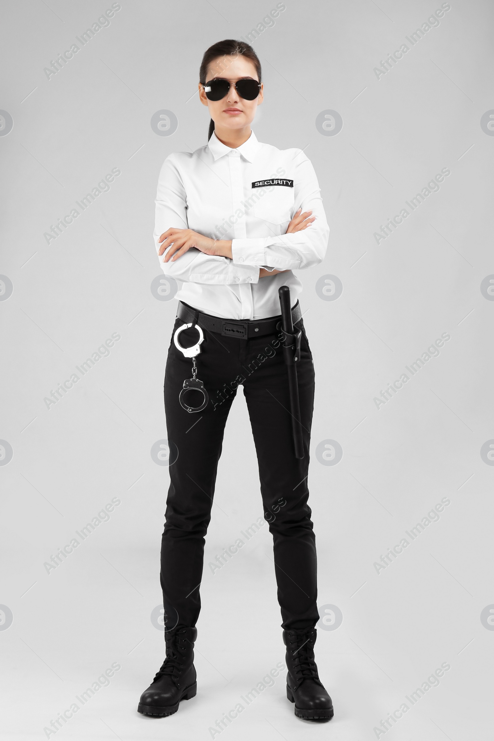 Photo of Female security guard in uniform on color background