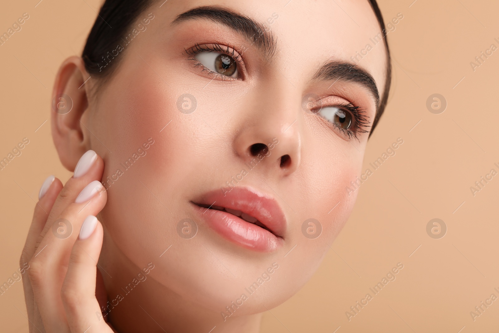 Photo of Beautiful woman with healthy skin on beige background, closeup