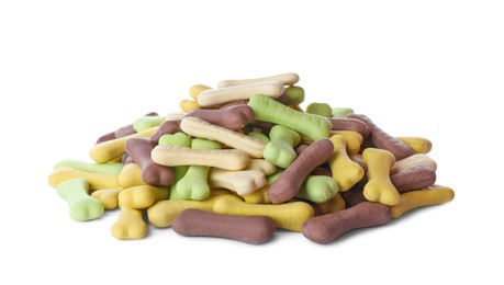 Pile of different bone shaped dog cookies on white background