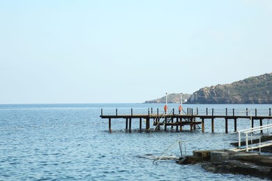 Photo of Picturesque view of sea and pier under blue sky