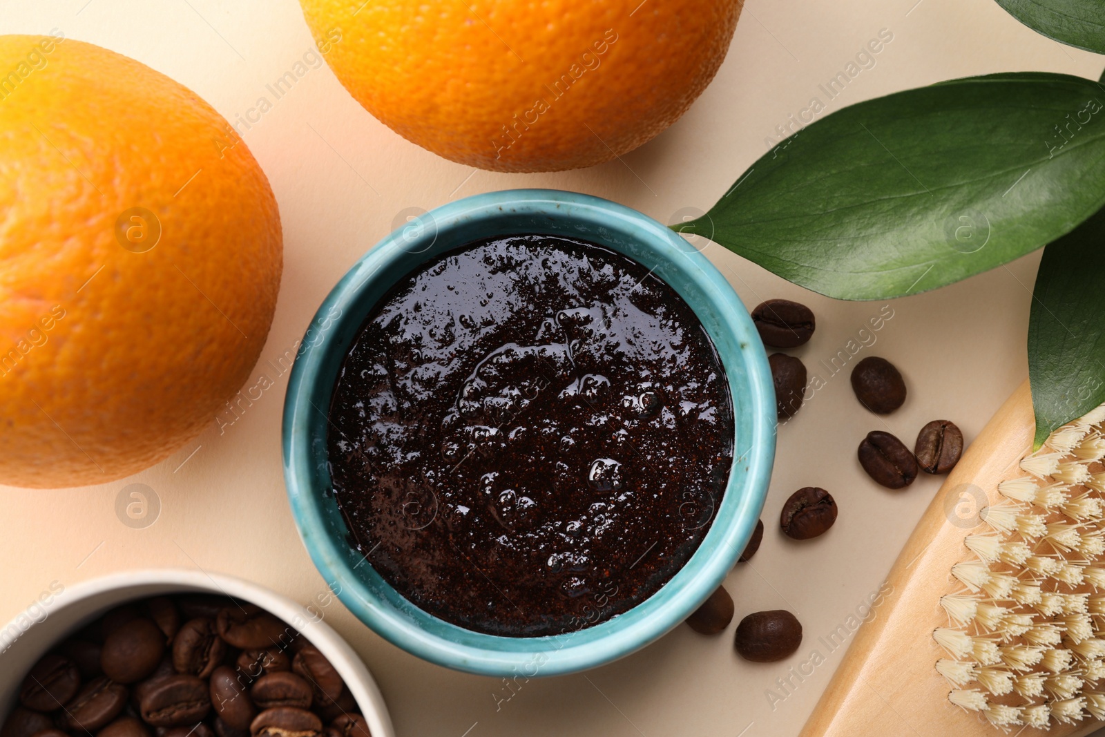 Photo of Flat lay composition with natural body scrub and fresh ingredients on beige background. Anti cellulite treatment