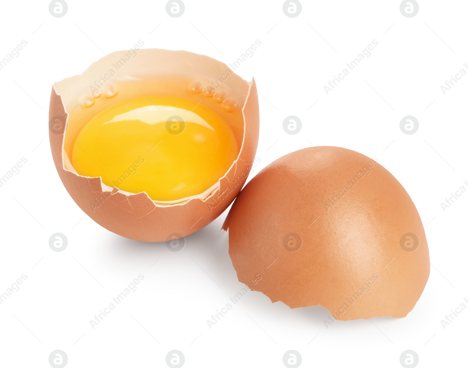 Photo of Cracked chicken egg with yolk isolated on white