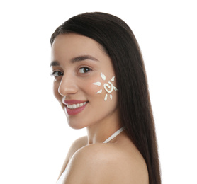 Young woman with sun protection cream on her face against white background