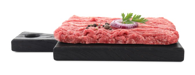 Photo of Board with raw ground meat, onion, peppercorns and parsley isolated on white