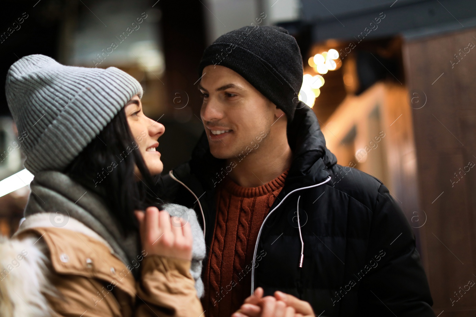 Photo of Lovely couple on city street. Winter vacation