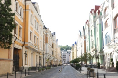 Photo of Blurred view of buildings with beautiful windows in city