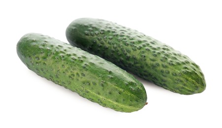 Photo of Whole fresh green cucumbers on white background