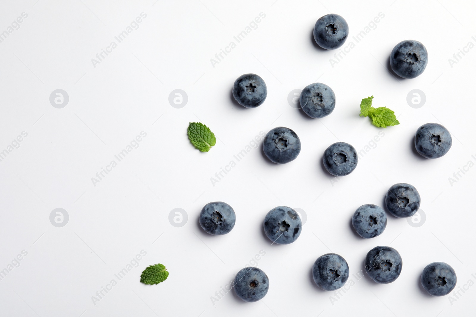 Photo of Flat lay composition with tasty blueberry and space for text on white background