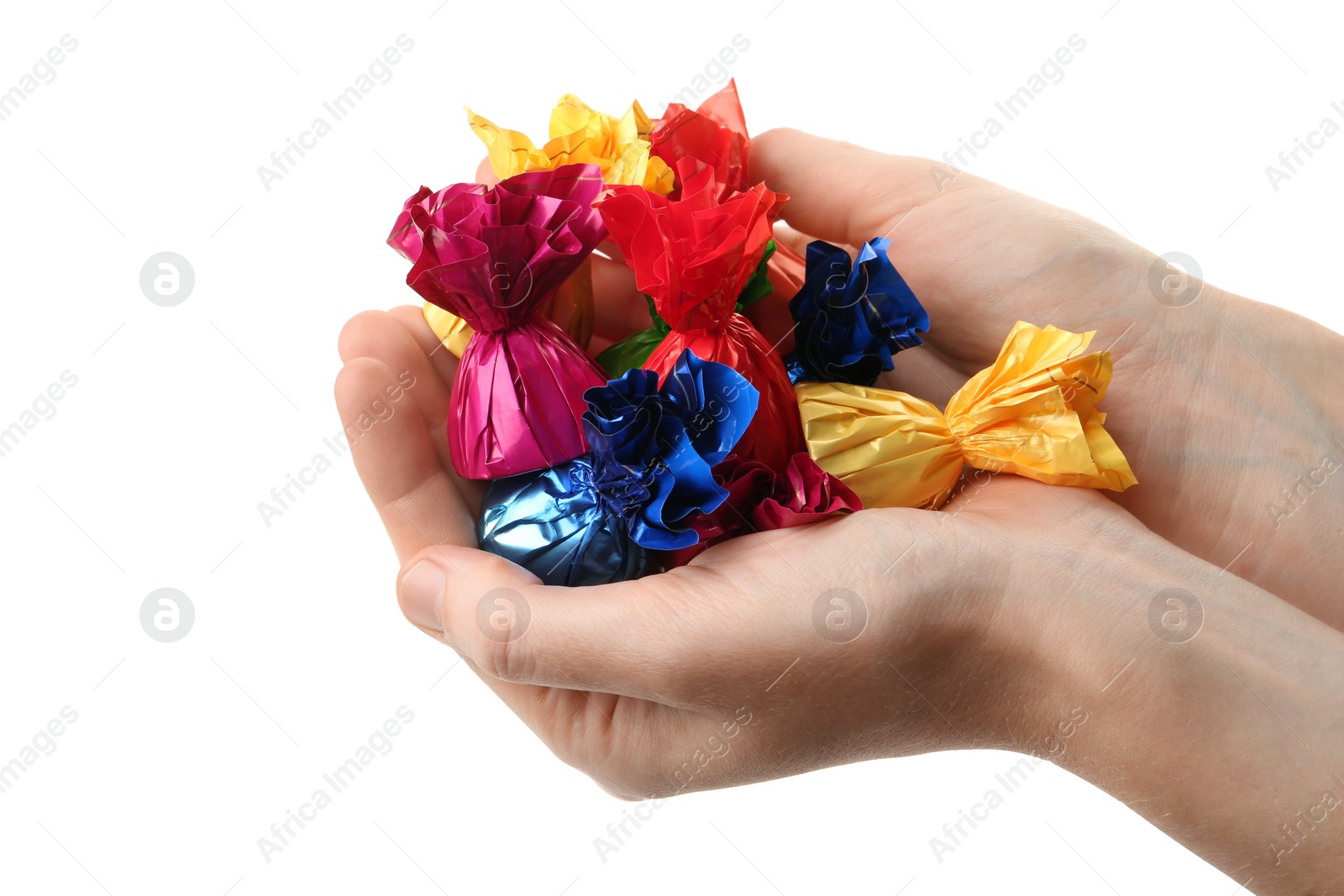 Photo of Woman holding heap of candies in colorful wrappers isolated on white, closeup