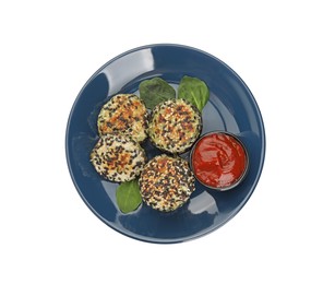 Photo of Plate of delicious vegan cutlets with sesame and sauce isolated on white, top view