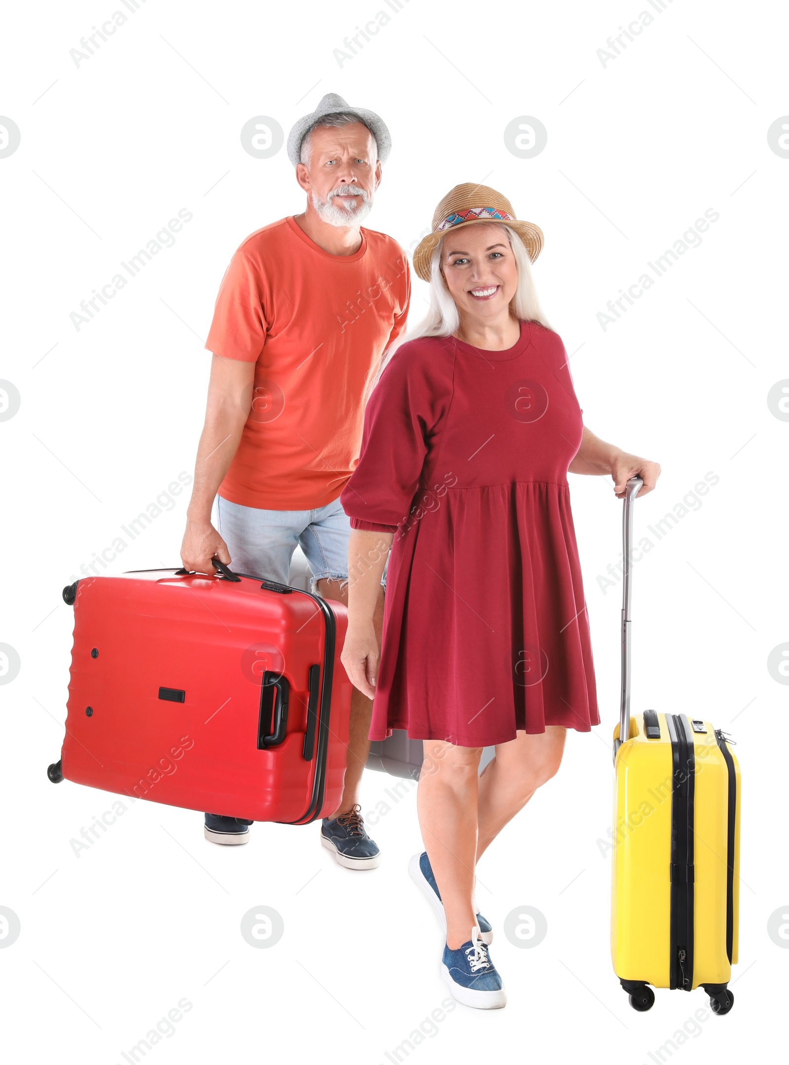 Photo of Senior couple with suitcases on white background. Vacation travel