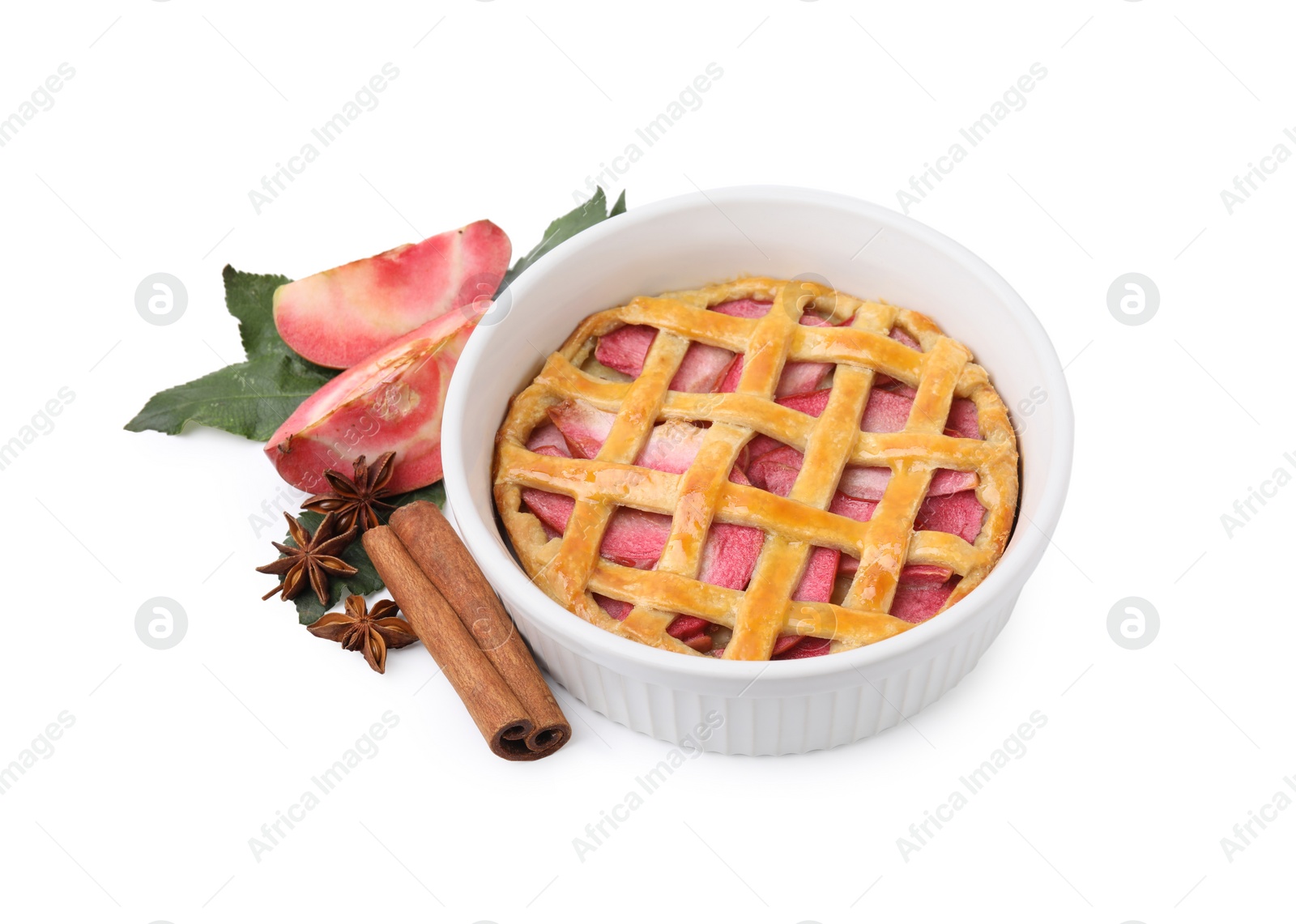 Photo of Tasty apple pie, fruit, leaves and spices isolated on white