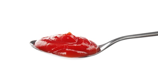Photo of Tasty homemade tomato sauce in spoon on white background