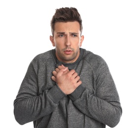 Young man suffering from cold on white background