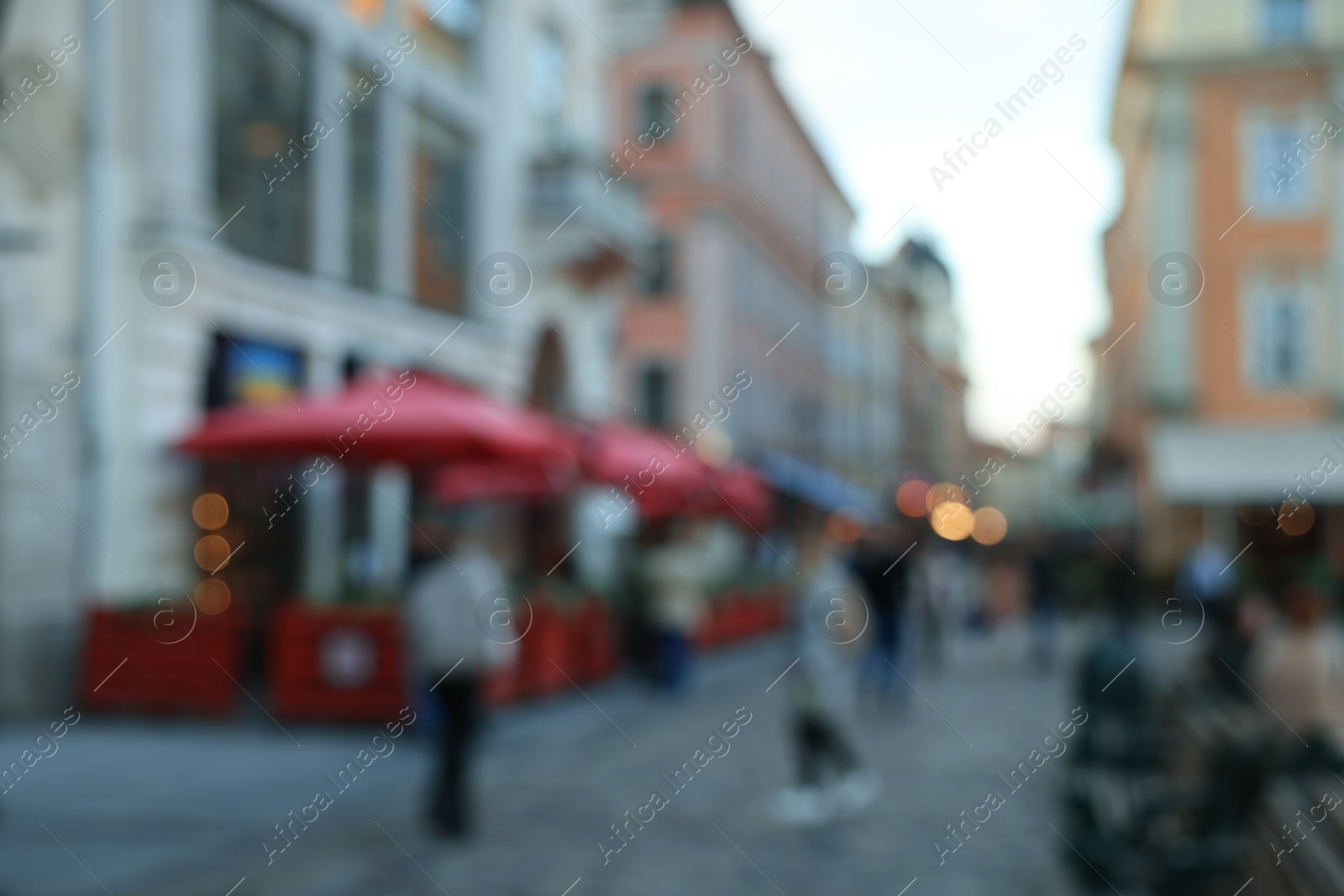 Photo of Blurred view of people walking on city street