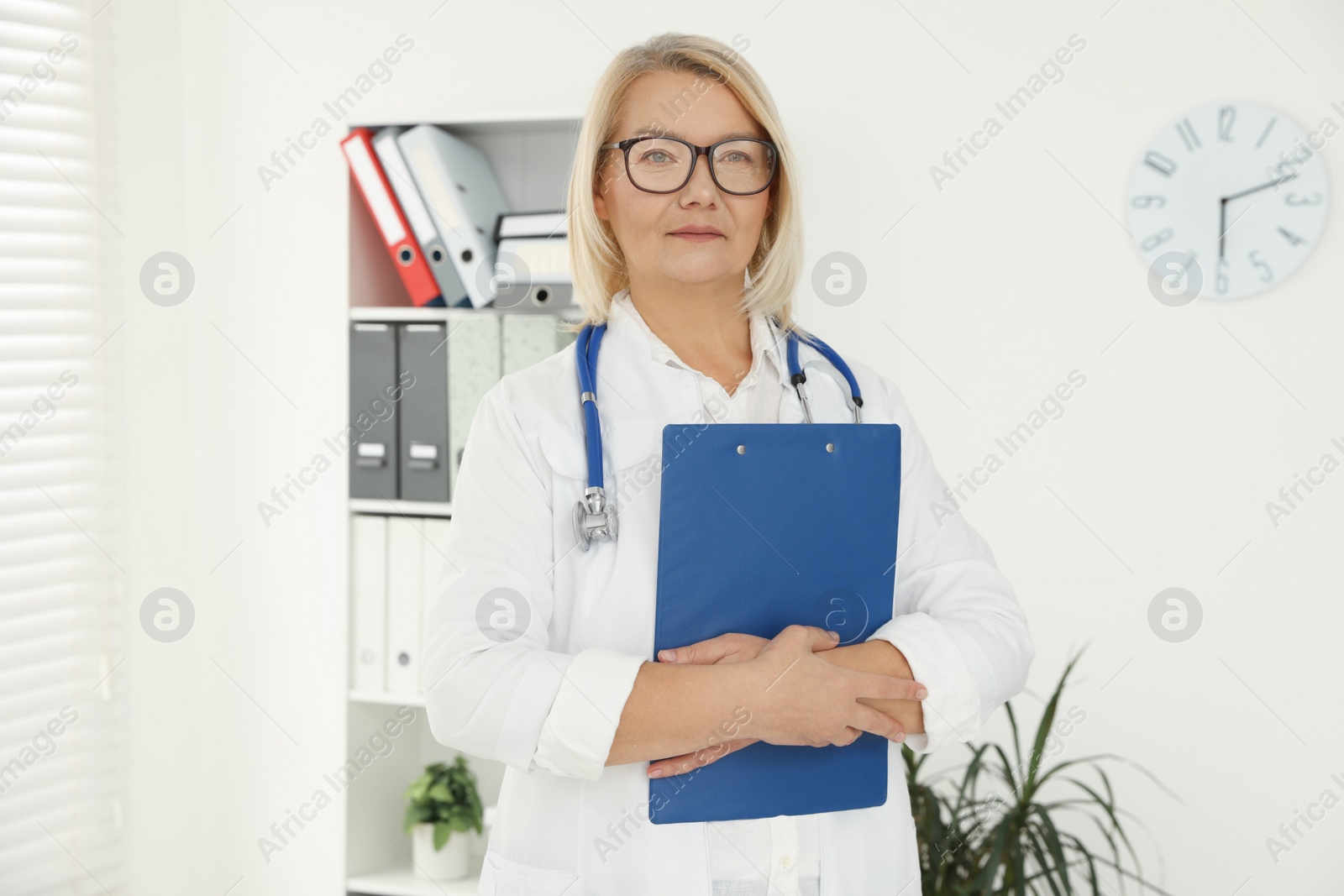 Photo of Professional doctor in uniform with stethoscope in clinic