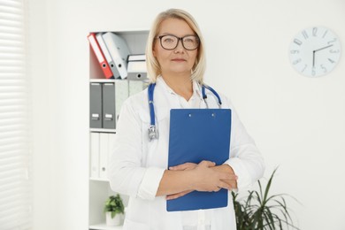 Professional doctor in uniform with stethoscope in clinic