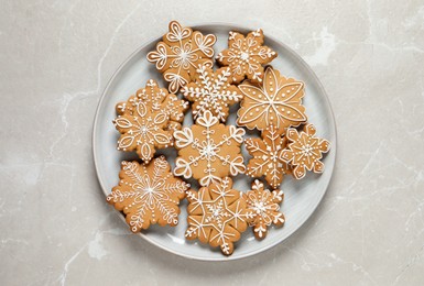 Photo of Tasty Christmas cookies on light grey table, top view