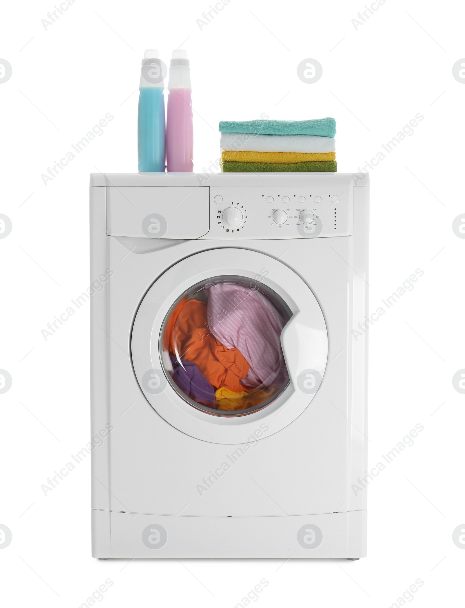Photo of Modern washing machine with laundry, stack of towels and detergents on white background