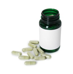 Photo of Bottle and pile of vitamin pills isolated on white