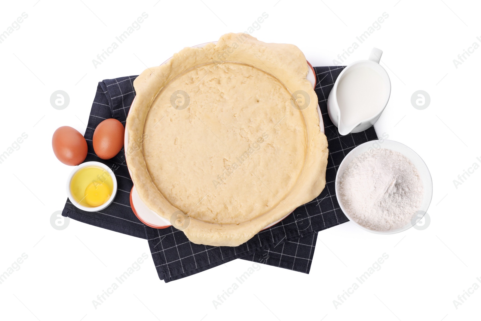 Photo of Quiche pan with fresh dough and ingredients isolated on white, top view