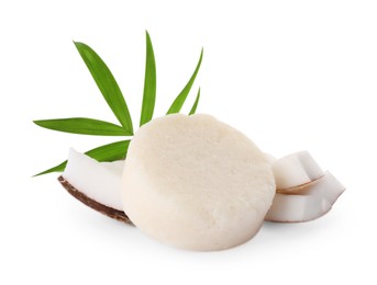 Photo of Solid shampoo bar, leaf and coconut pieces on white background. Hair care