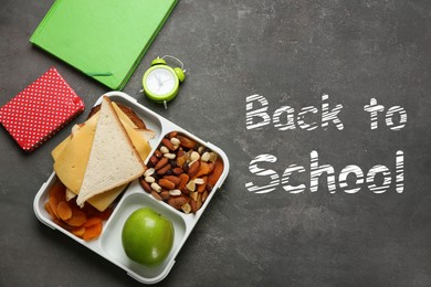 Image of Flat lay composition with lunch box and appetizing food for school on grey background