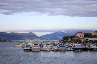 Picturesque view of mountains, town, moored boats and sea