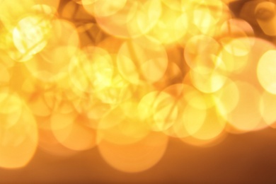 Photo of Gold glitter with bokeh effect as background