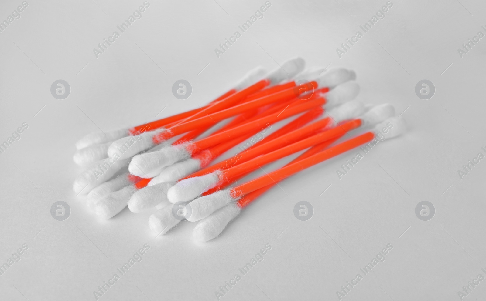 Photo of Heap of clean cotton buds on white background