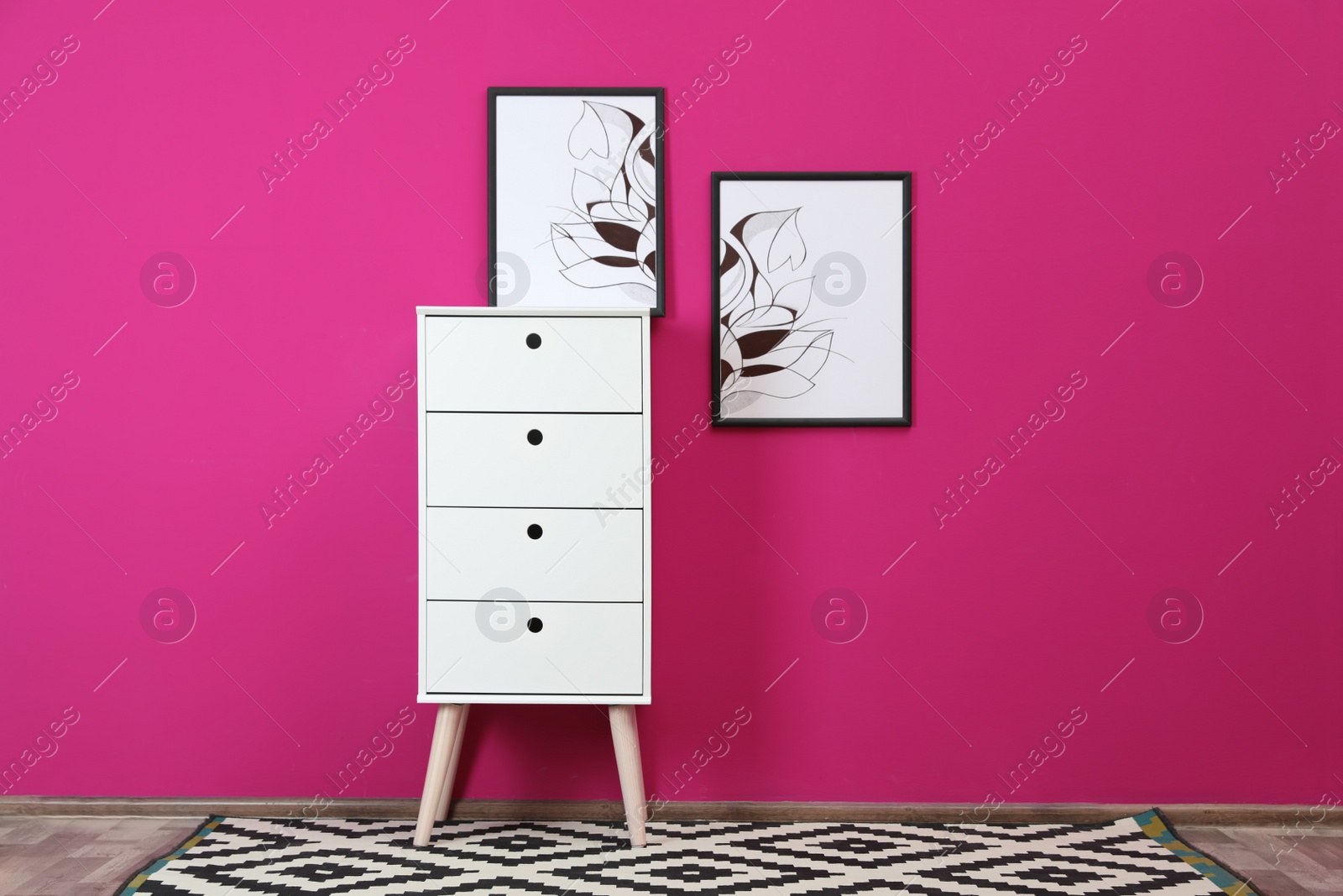 Photo of Stylish living room interior with chest of drawers