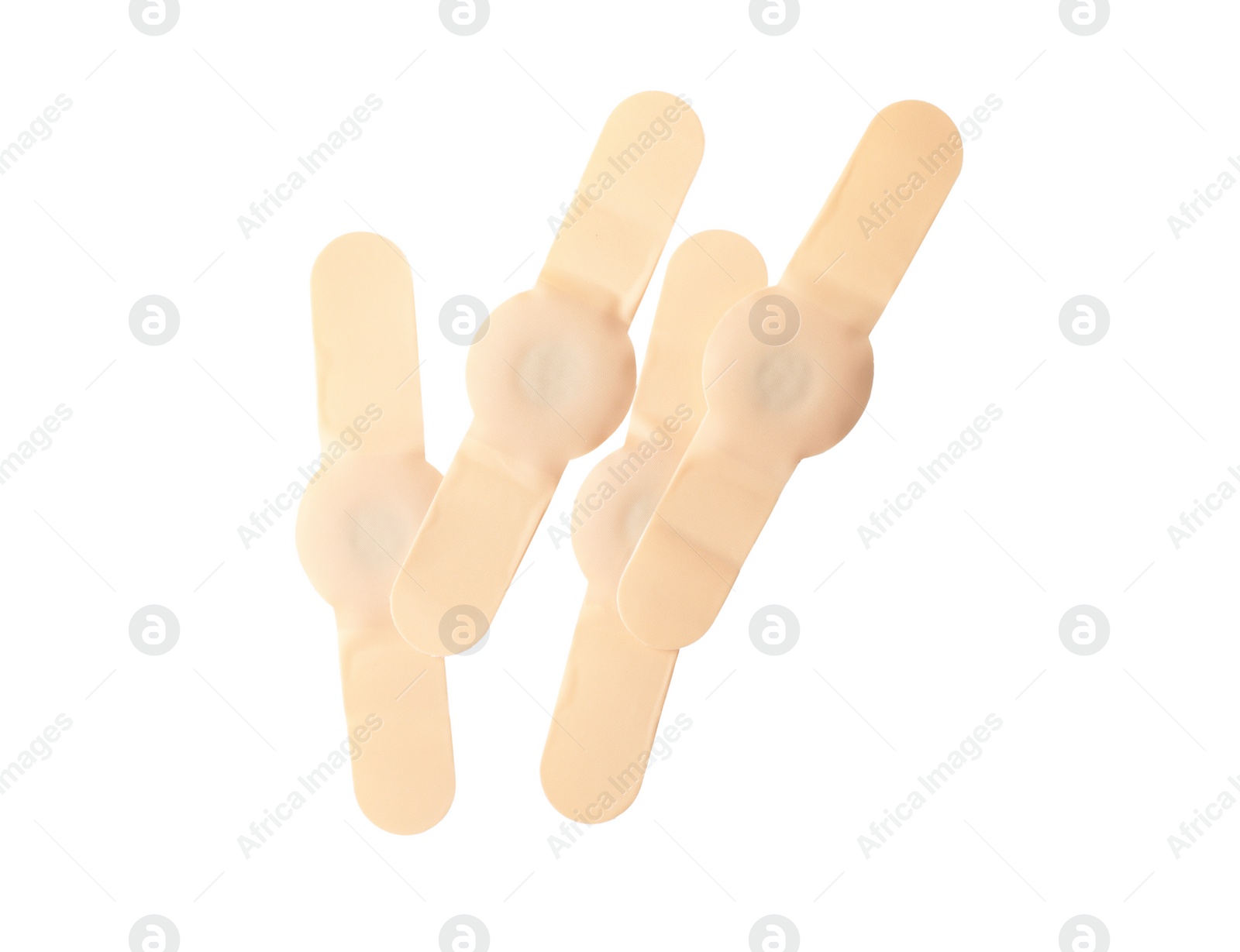 Medical sticking plasters isolated on white. First aid item Photo of Medical sticking plasters isolated on white. First aid item