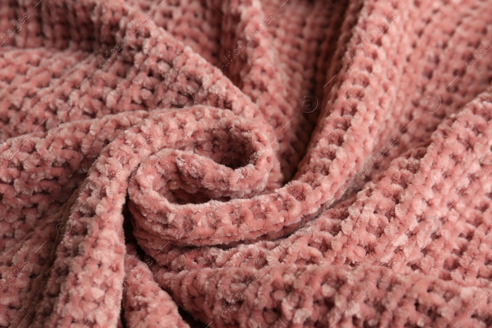 Photo of Beautiful pink knitted fabric as background, closeup