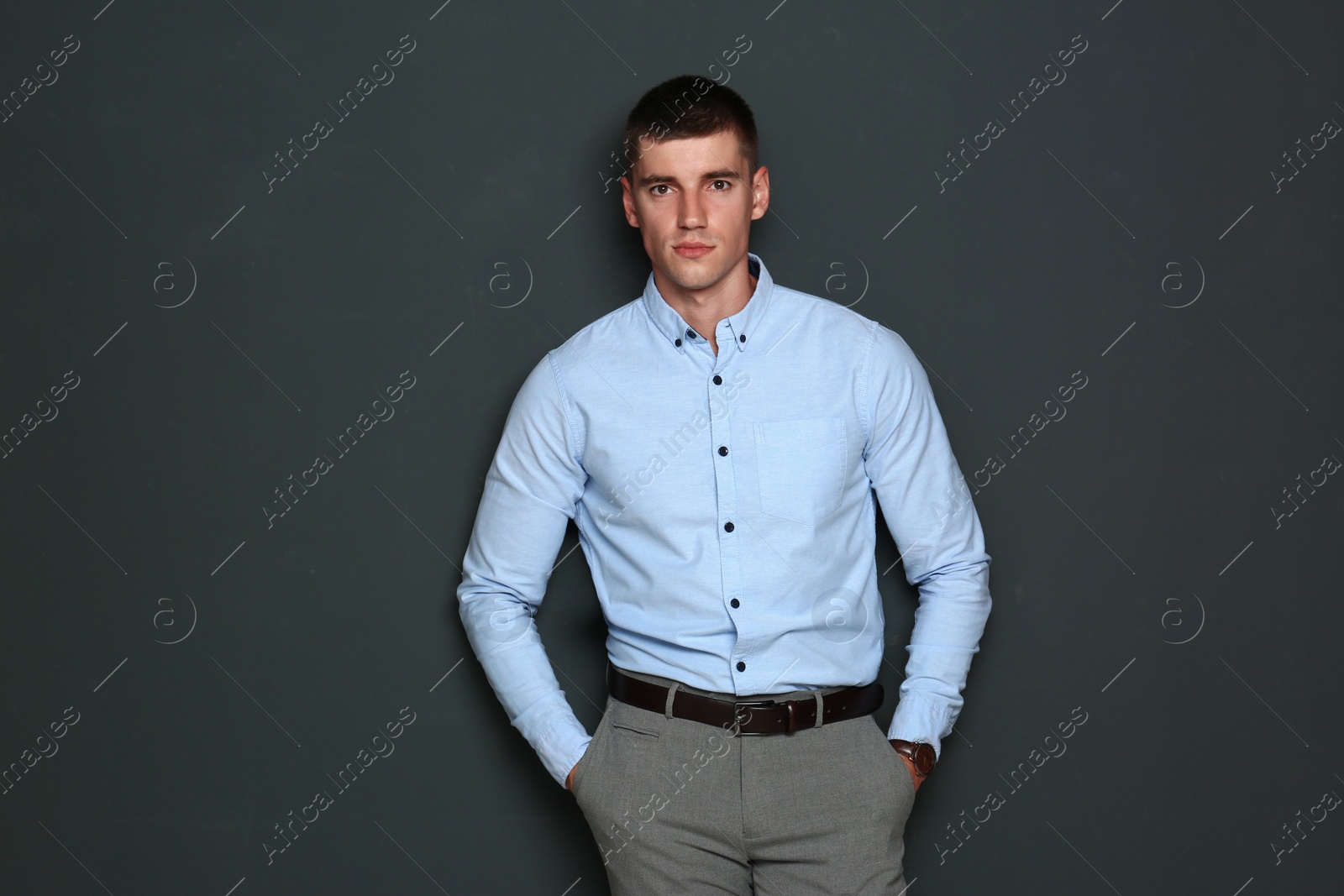 Photo of Portrait of handsome young man on dark background