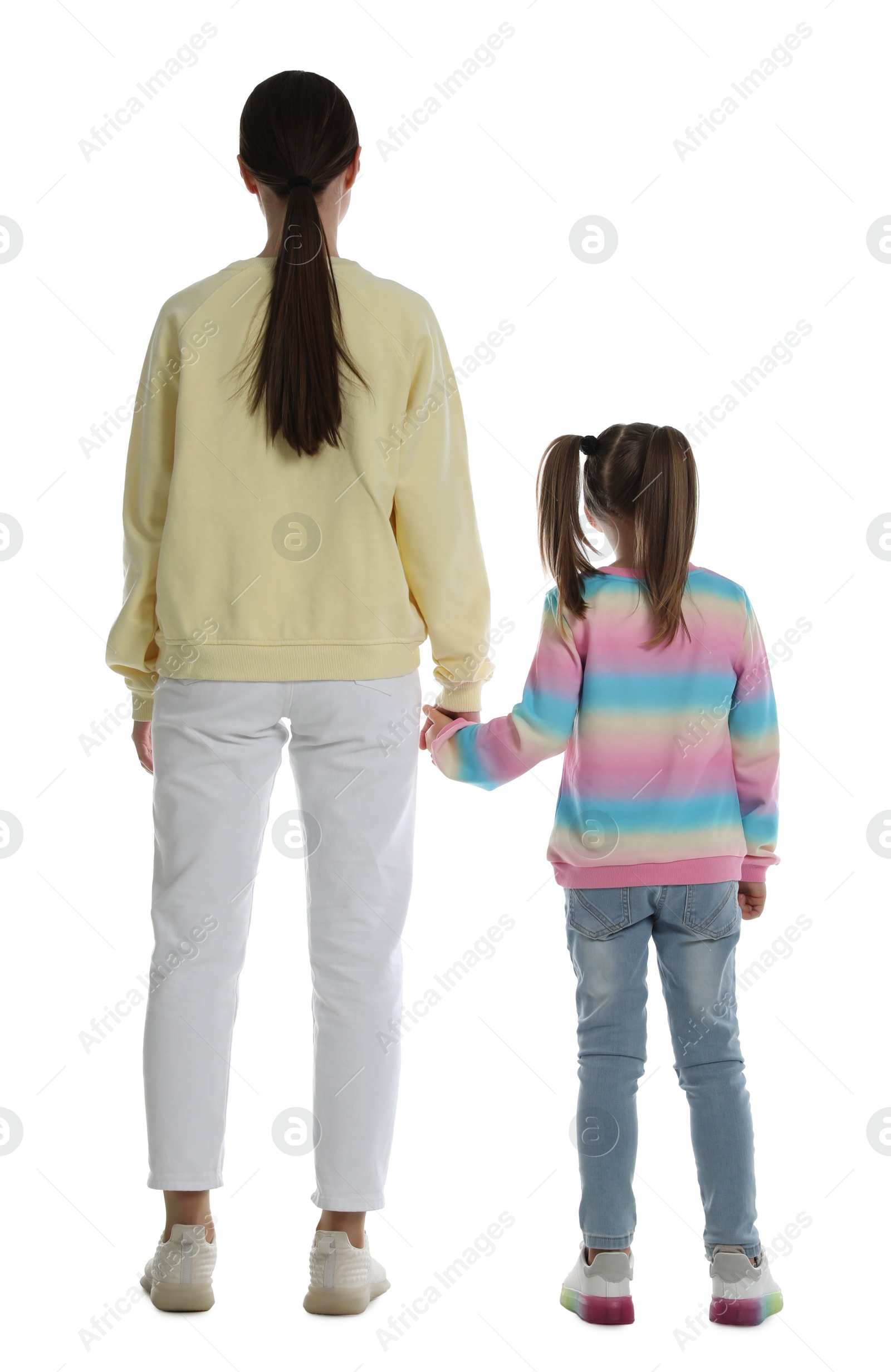 Photo of Little girl with her mother on white background, back view