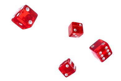 Image of Four red dice in air on white background