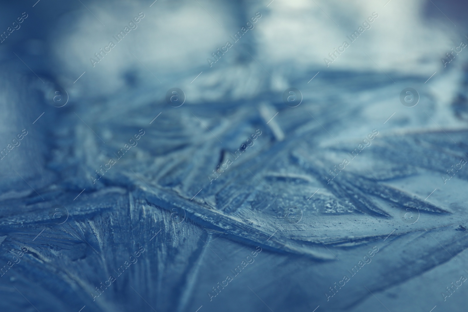 Photo of Frosty blue surface, closeup. Beautiful winter ornament