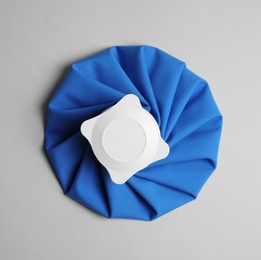 Photo of Ice pack on light background, top view