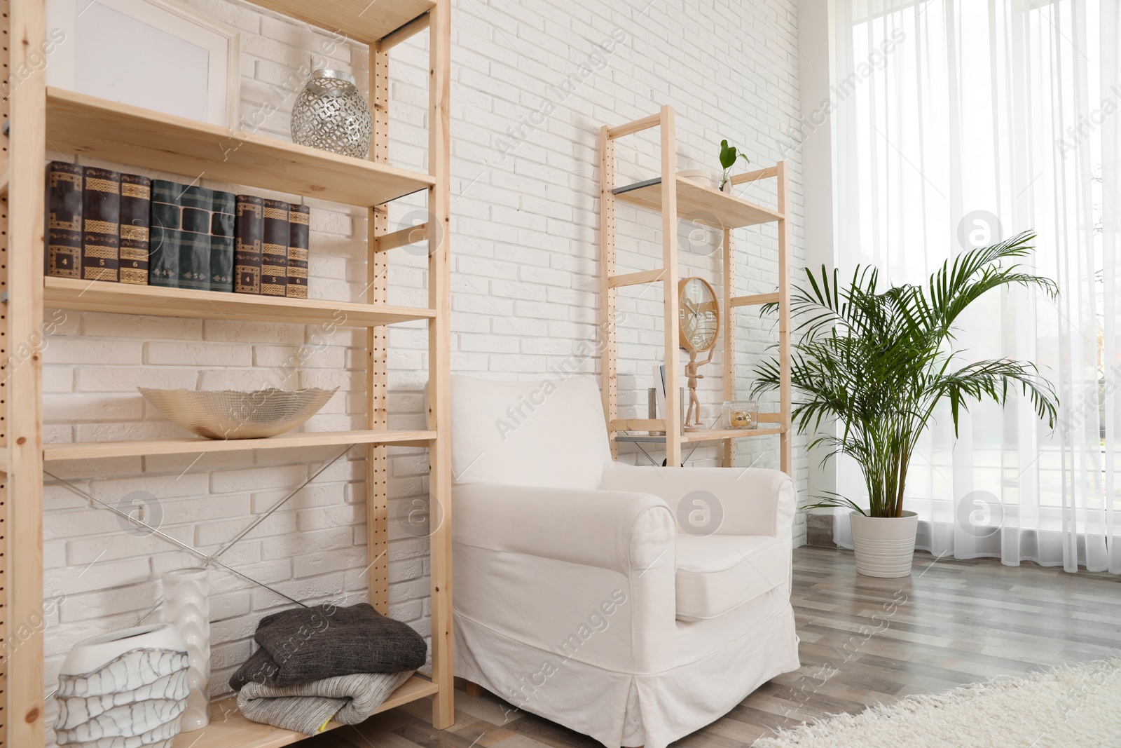 Photo of Wooden storage in stylish living room. Idea for interior design