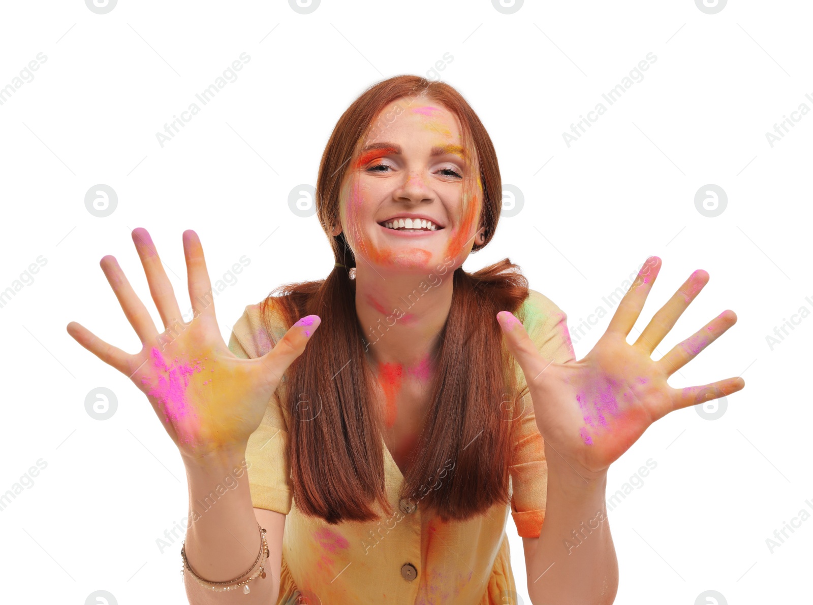 Photo of Woman covered with colorful powder dyes on white background. Holi festival celebration