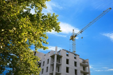 View of unfinished building against blue sky