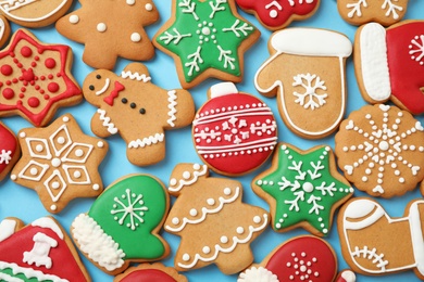 Photo of Flat lay composition with tasty homemade Christmas cookies on light blue background