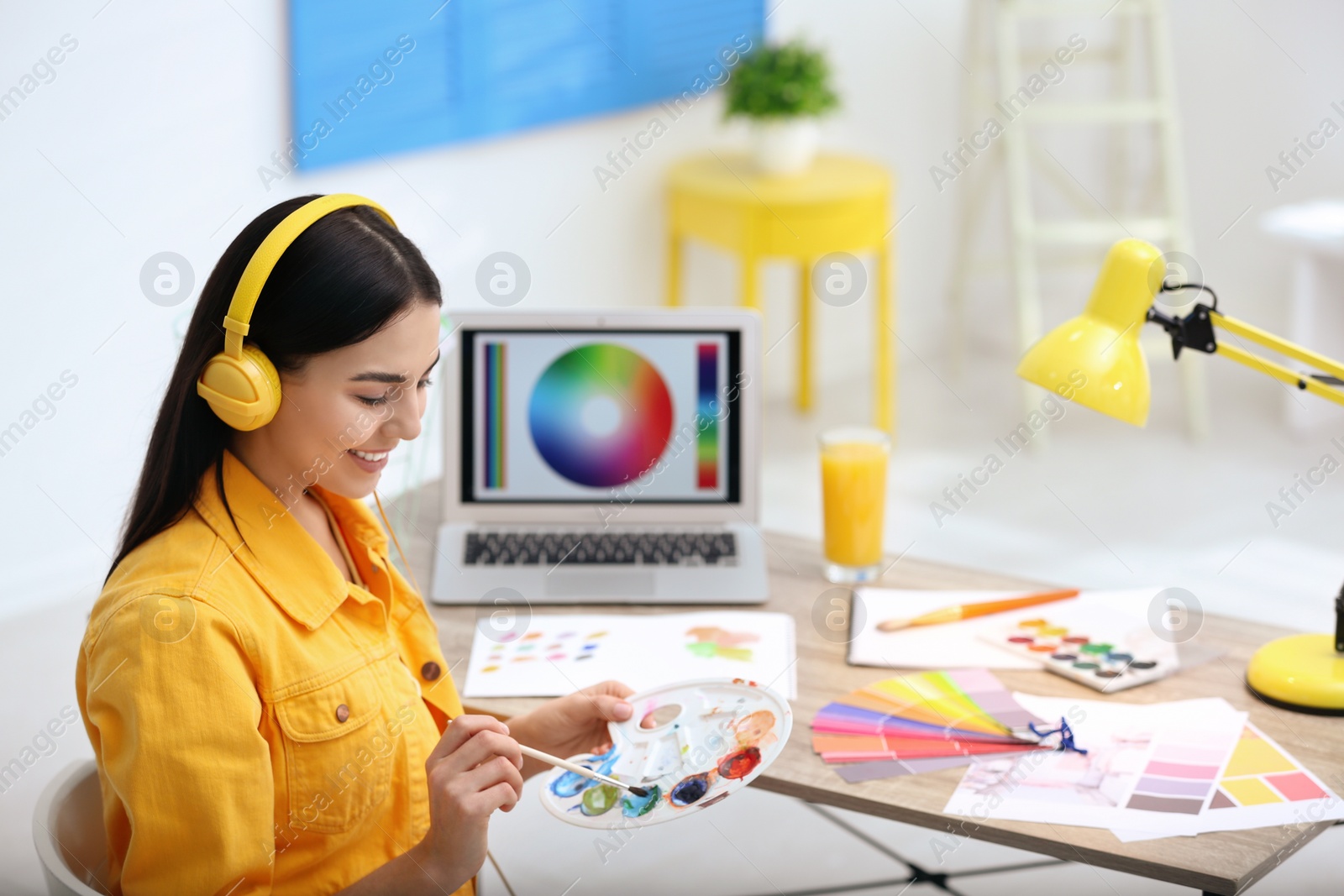 Photo of Female designer working at desk in office