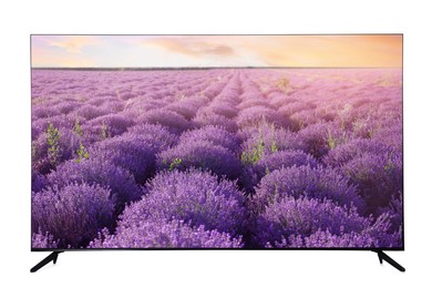Image of Modern wide screen TV monitor showing beautiful lavender field isolated on white