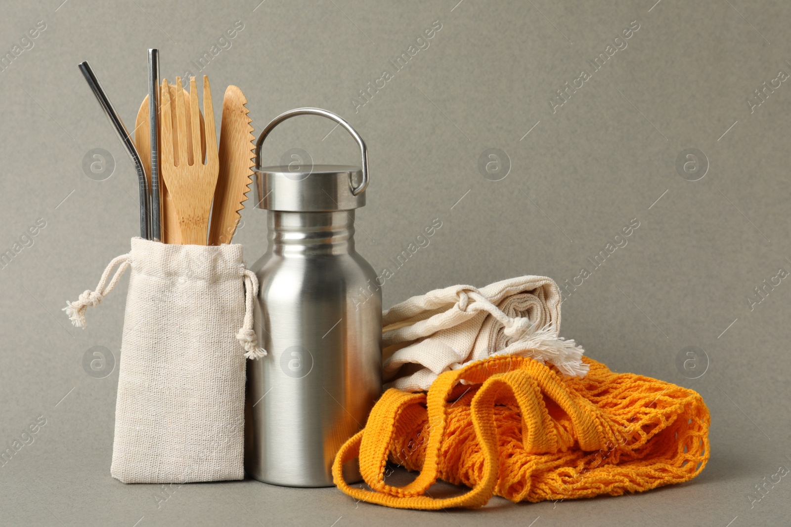 Photo of Composition with eco friendly products on grey background. Conscious consumption