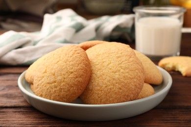 Photo of Delicious Danish butter cookies on wooden table, closeup