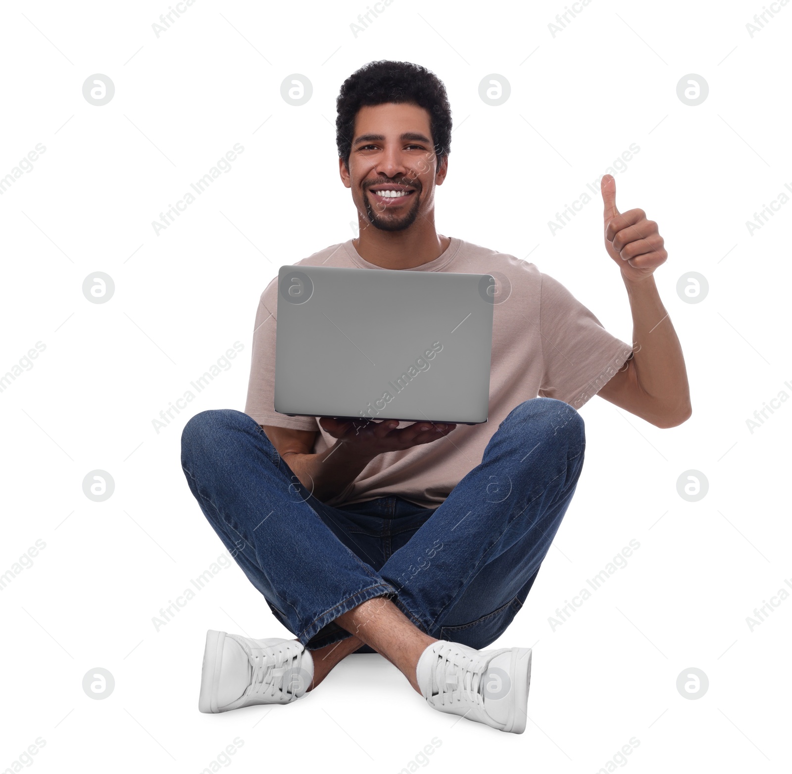 Photo of Happy man with laptop showing thumb up on white background